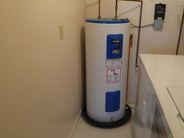 Older Electric Water Heater with Catchment Tray
